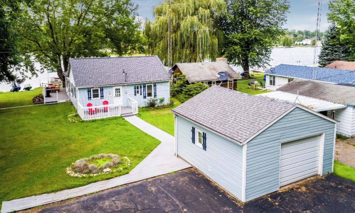 Benton Harbor House | Happiness is a good book, a dog by your side, and a dock on the lake
