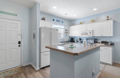 Southport House | 4136 Vanessa Dr Unit 13: 3-bedroom condo in Southport with a private pool