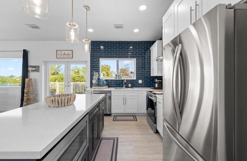 Marathon Villa | Blue Pearl New Waterfront Haven with Heated Pool ,70 Foot Dock, and More!