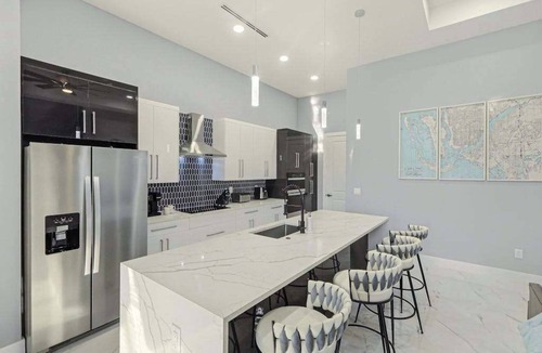 Trafalgar House | Canal front home with saltwater pool, hot tub, and washer and dryer.