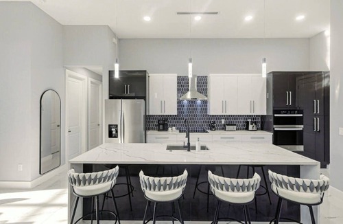 Trafalgar House | Canal front home with saltwater pool, hot tub, and washer and dryer.
