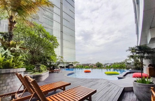 Ngaglik Apartment | Classic Wooden Touch Studio Room At Apartment Mataram City
