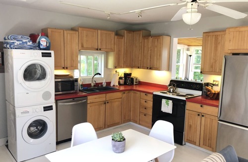 Town of Torrey House | Cozy Cabin With 165 Ft Beach and wood-fired hot tub! Center of FLX wine country!