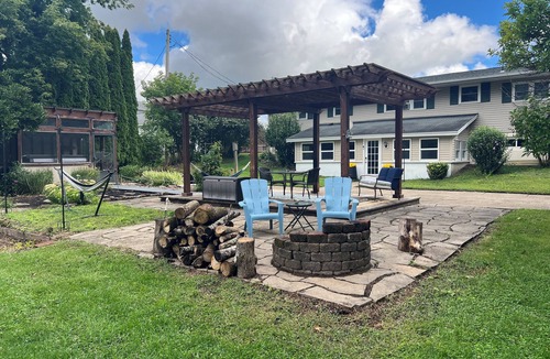 Phoenix House | Cozy Oswego River Area Basement Suite Sunroom & Hot Tub in Phoenix NY