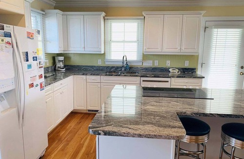 Holden Beach House | Experience oceanfront luxury at Sweet Dreams, a spacious 4BR retreat in Holden Beach.