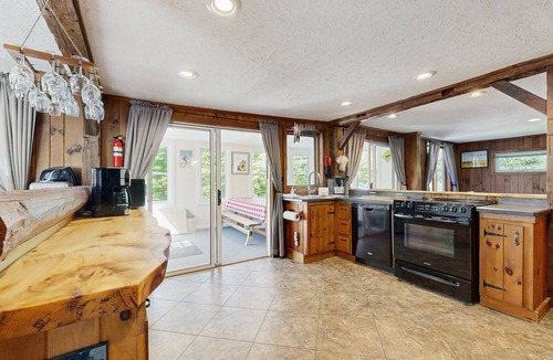 Montgomery Center House | Inviting riverfront home with hot tub on deck & fireplace, near skiing & golf