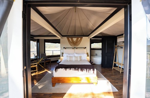 Coosa Resort | Lake Front Exclusive Glamping Tent: Hot Tub, TV, & Soaking Tub