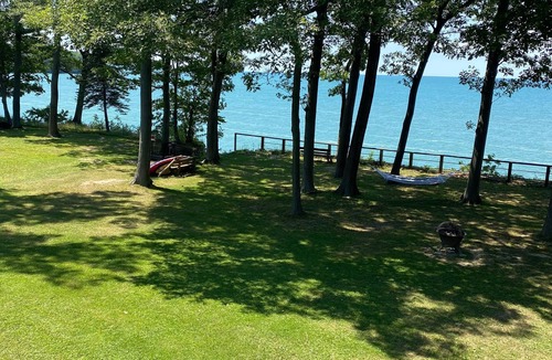 Irving House | Lake Front Home. Private stairs to private beach and bay. upscale 5 bedroom home