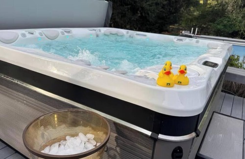 Norwalk House | Spacious 4-bedroom house with AC in tranquil Norwalk. Year round hot tub. Pool