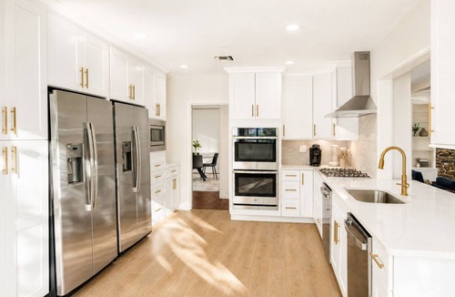 Gunter Afs House | Spacious 7BR home featuring a private pool, separate pool house, game room, Peloton-equipped workout sunroom, dedicated office, multiple living areas, and a fully equipped kitchen—perfect for families, groups, and extended stays.