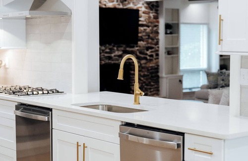 Gunter Afs House | Spacious 7BR home featuring a private pool, separate pool house, game room, Peloton-equipped workout sunroom, dedicated office, multiple living areas, and a fully equipped kitchen—perfect for families, groups, and extended stays.