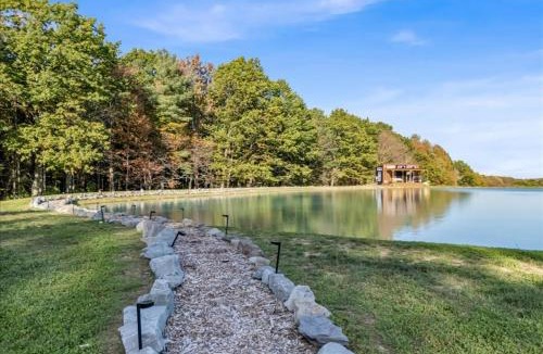 Brackney House | Tiny House On a Tiny Lake Porch at Waters Edge