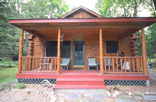 Bellaire House | Waterfront log home on Lake Bellaire. Pet friendly. Fireplace, dock. Dog ok