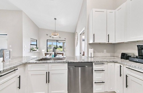 Pebble Beach House | Waterside Villa! Family Home! Pool! BBQ! Fishing