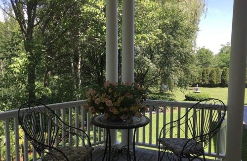 Williston North House | Williston Village INN- Brass room with King size Bed for two people
