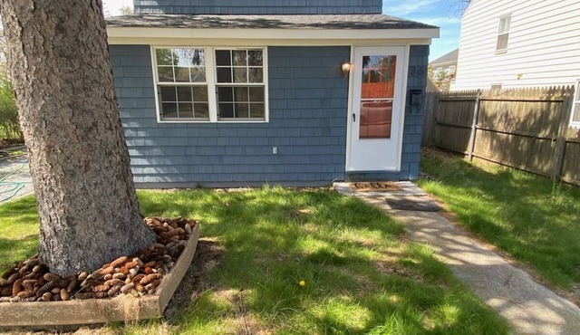 Charming Riverhead home with large outdoor patio & backyard firepit
