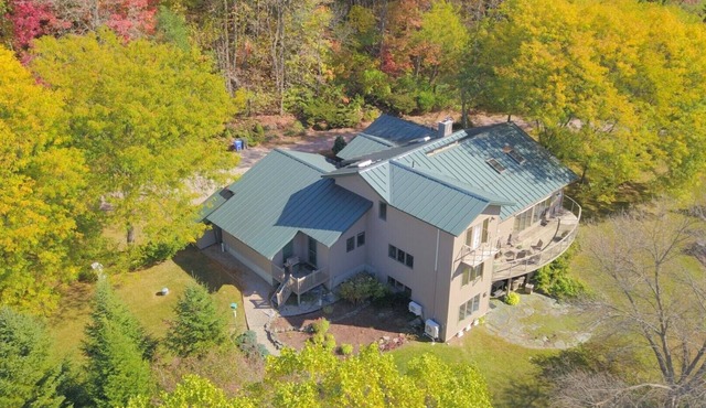 Custom 3-bedroom contemporary home on 10 rural acres yet near all amenities