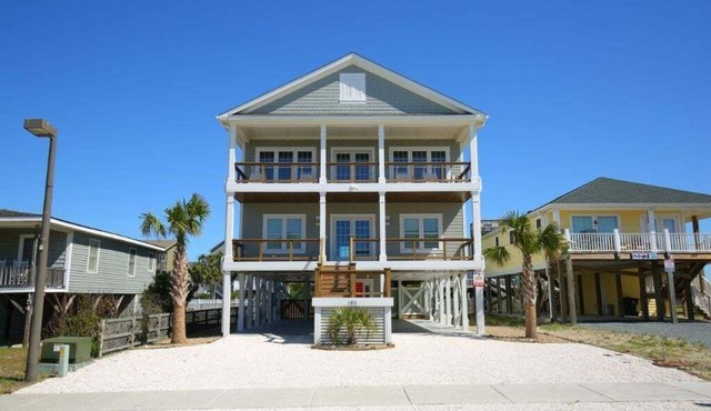 Experience Absolute Paradise: a spacious 5-bedroom home steps from Holden Beach.