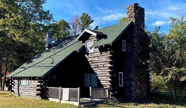 Fully Restored 3-bedroom log cabin in Tupper Lake perfect for relaxing stays.