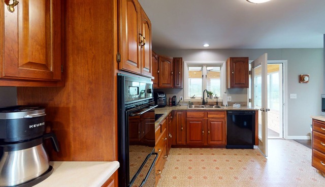 Home with mountain views, large yard, fire pit, deck & 3-season room