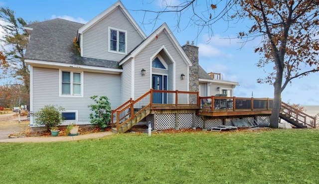 Lakefront home with water access, views of the mountains, private deck & patio