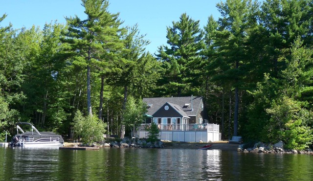 Private Peninsula, 600’ Of Waterfront + Sandy Beach on Sunrise Lake