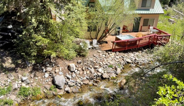 Quiet streamside retreat Hot Tub Deck overlooking the creek Wood-burning stove Tucked below Sundance