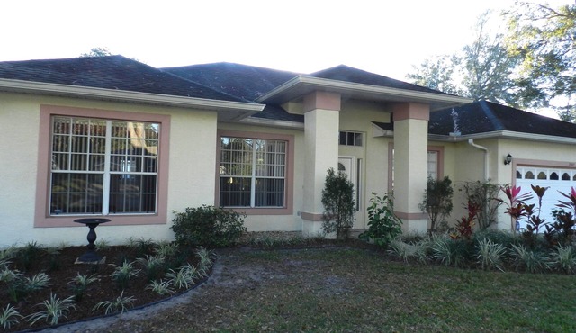 Relax in our hot tub at our 4 Bedroom, 3 Bathroom villa in Doral Woods