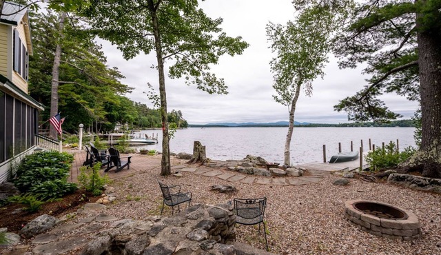 Timeless lakefront home on Lake Winnipesaukee with screened-in porch and dock